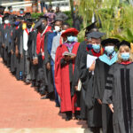 Graduates lined up to receiving their degrees.