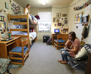 LBC student hanging out in their dorm room.