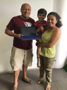 Pastor Felix and his wife, Jenny, receive the tablet that will help them share the gospel.