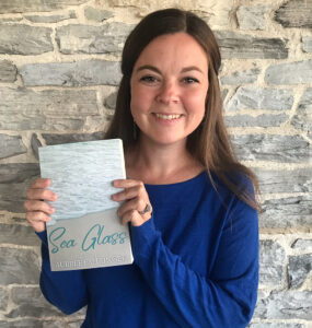 alumna author aubree fahringer with her book, sea glass
