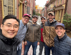 Students and their professors take a break for a selfie while walking the historic streets of Philadelphia.