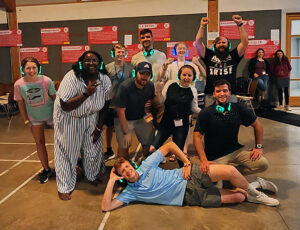 Students and staff take a break from "silent disco" for a photo opp during the Christian Endeavor World Convention in Germany in July 2023. LBC Business Administration major Zach Coryell (’27) is in the center in light blue.