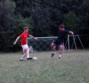 Zach Coryell (’27), left, leads a soccer tournament at the Christian Endeavor World Convention.