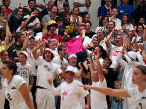 Dr. Shirley Tucker crowd-surfs during a Chargers basketball game. 
