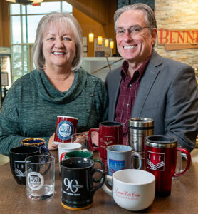 Sharon & Dale Mort with some of their LBC mug collection.