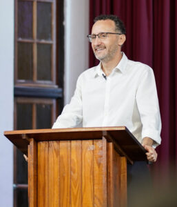 Argentinian pastor Guillermo MacKenzie at pulpit