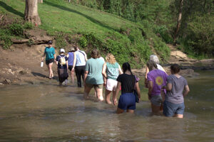 thailand journey team crosses a river