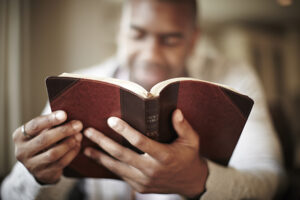 man reading bible