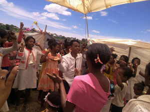 Aina Aime (’25), center in white shirt, shares the Christmas traditions in his home country of Madagascar.