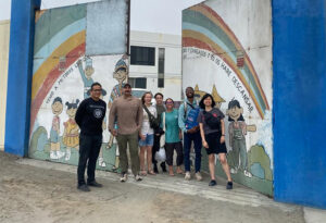 lbc students gather outside an orphanage in peru