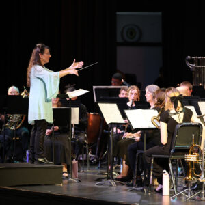 Doris Hall-Gulati conducts the LBC Wind Ensemble in March 2025.