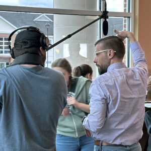 Dr. Ryan Geesaman instructs Media Arts Production students for a year-end project.