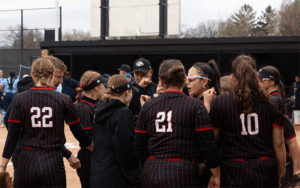 the LBC softball team celebrates on the mound